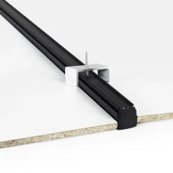 Accesorio de fijación para carril trifásico empotrable