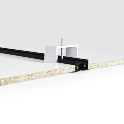 Accesorio de fijación para carril trifásico empotrable
